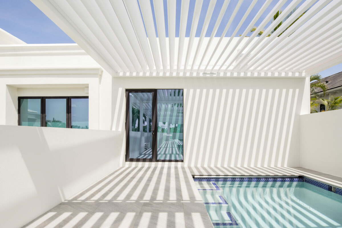 Rooftop pool covered with Louvered pergola R-Blade by Azenco. Delray Beach, FL