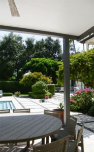 Modern fixed roof pergola with smart patio automation integrated - Azenco R-Shade in South Florida