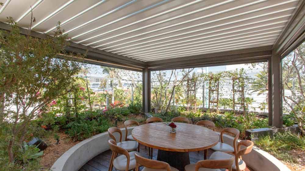 pergola with angled roof vs. louvered roof