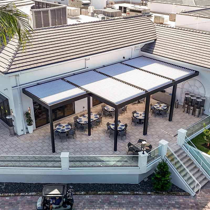 Multiple motorized pergolas to cover the Broken Sound Clucb Terrace - custom R-BLADE pergola by Aznco