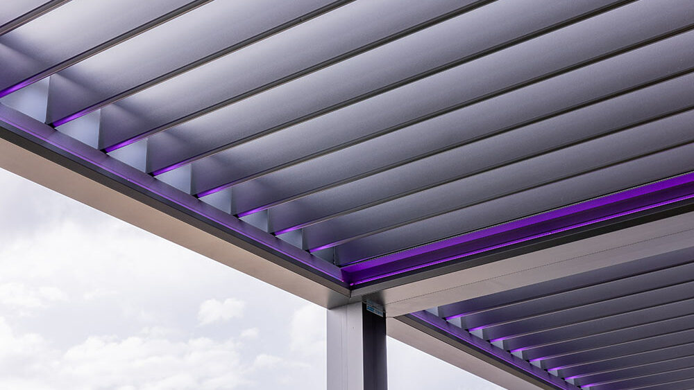 Extend your living space outdoors with a custom operable pergola you can control with the touch of a button. That's the magic of the R-BLADE™ Louvered Roof Pergola by Azenco Outdoor, the perfect solution for enjoying Florida's sunshine or seeking shelter from unexpected rain showers.